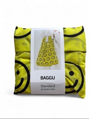 BAGGU Yellow Happy design. Reusable nylon tote bag with black smiley faces